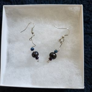 Silver hanging earrings with teal and purple